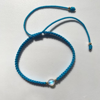 Pulsera tejida con ópalo sintético