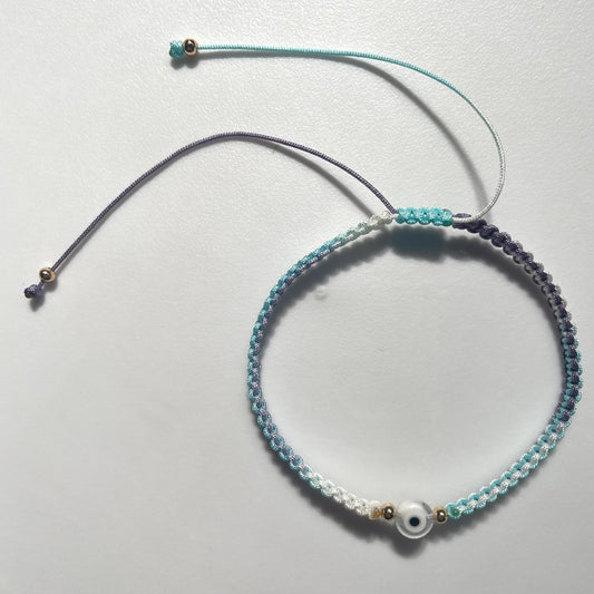 Pulsera tejida con ojo turco de vidrio