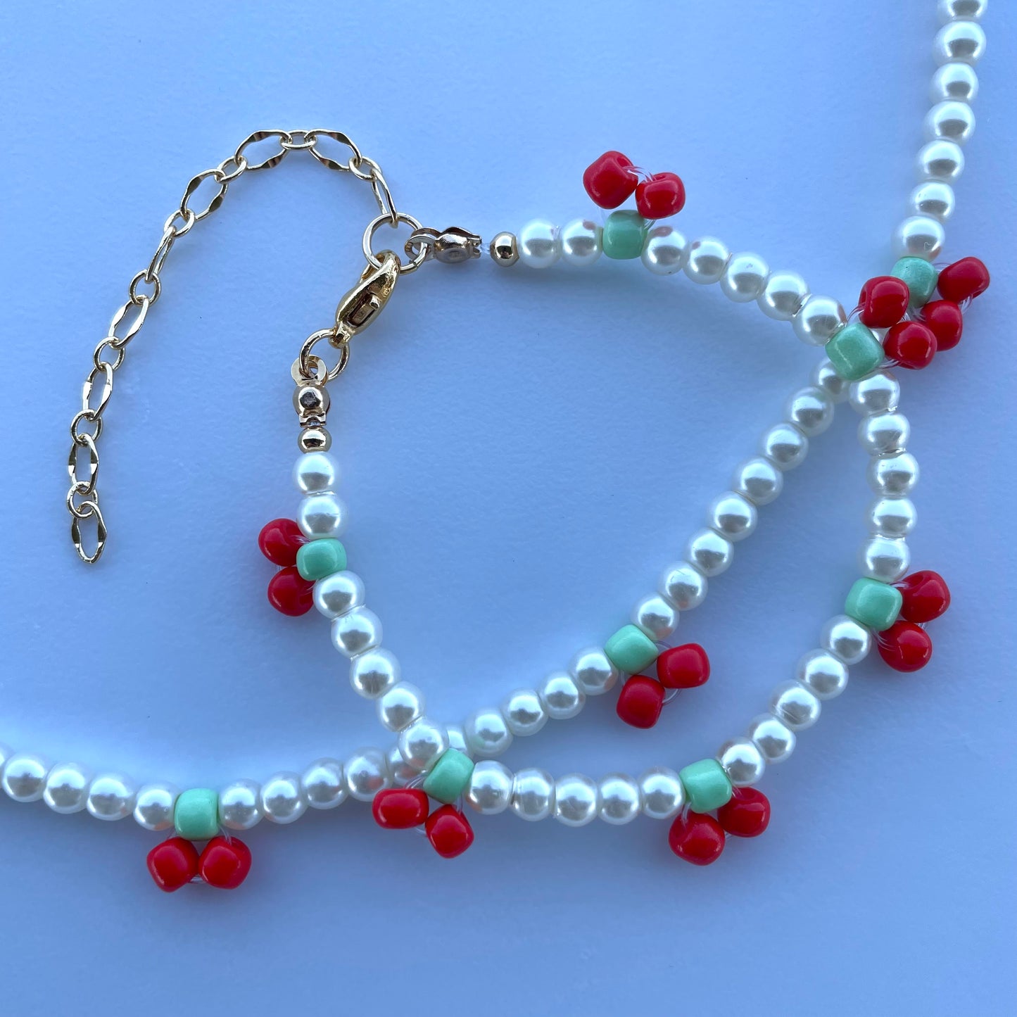 Set de collar y pulsera de perla sintética con cerezas