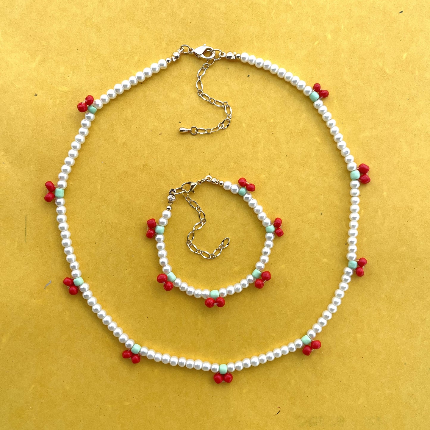 Set de collar y pulsera de perla sintética con cerezas