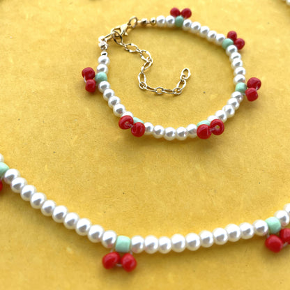 Set de collar y pulsera de perla sintética con cerezas